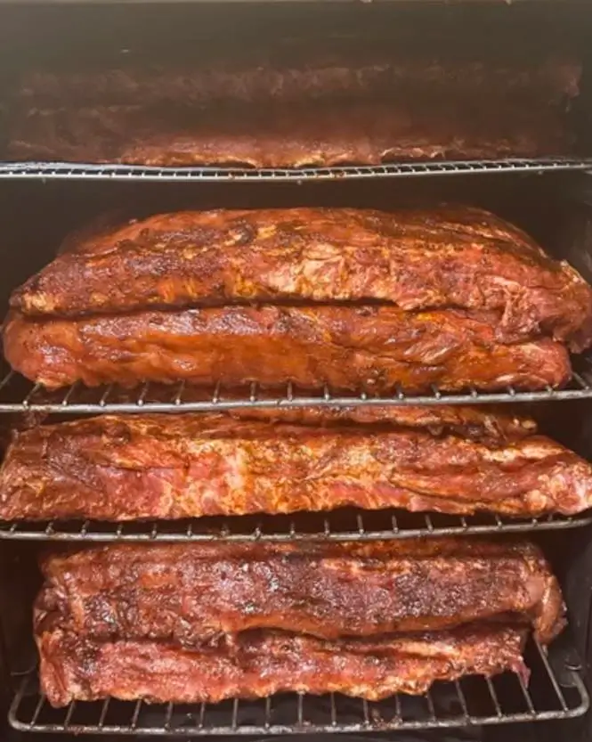 Kristin preparing slow-smoked BBQ